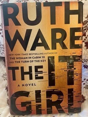 Ruth Ware "The It Girl" Hardcover - Metallic Orange & Black